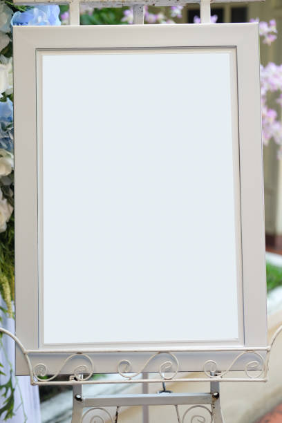 istock White picture frame and stand in wedding 883042412