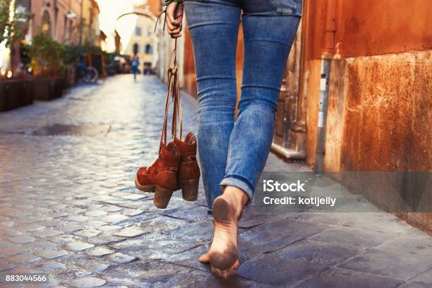 Barefoot Woman Walking On Street Stock Photo - Download Image Now - Barefoot, One Woman Only, Women