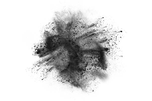 частицы древесного угля, забрызганные на белом фоне - powder make up стоковые фото и изображения