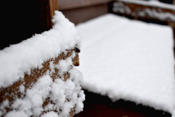 istock Snow on the wooden construction table 883045914