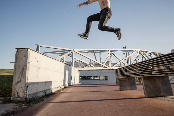 istock Man practicing parkour in the city 883055258