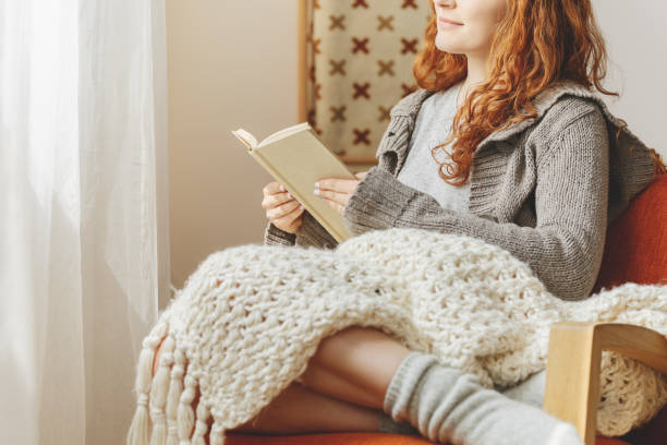 istock Woman sitting in a chair 883056684