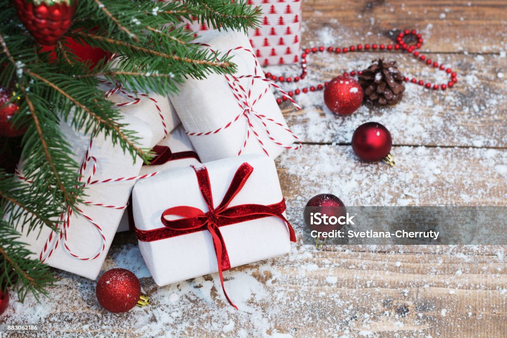 Christmas holiday background. Gifts under christmas tree. Copy space on white. Christmas Present Stock Photo