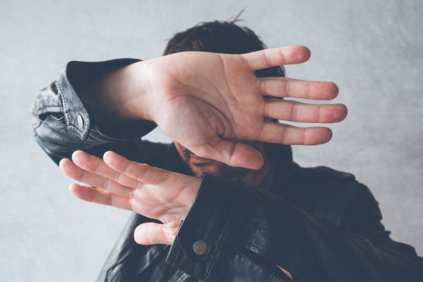 istock Celebrity male hiding face 883065740
