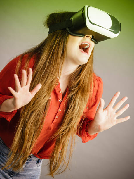 istock Girl wearing virtual reality goggles. 883066156