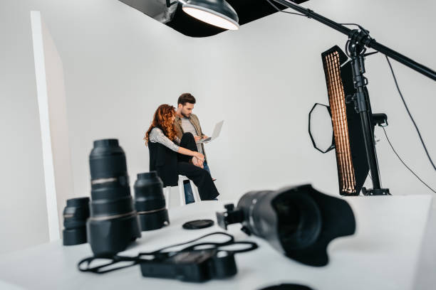 istock photographer and model in photo studio 883068500