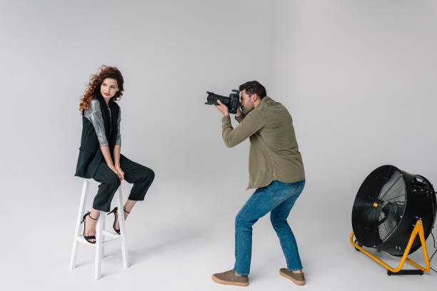 istock photographer and model on fashion shoot 883068722