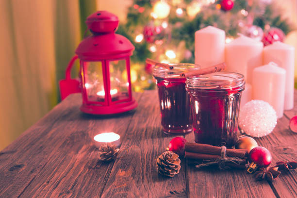 istock Christmas mulled wine on wooden plank over christmas tree 883073150