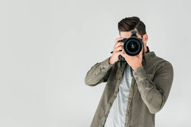 istock photographer with digital photo camera 883073804