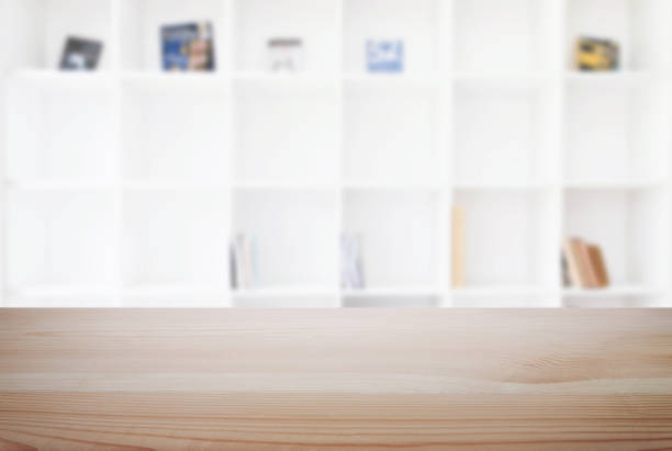 istock Empty wooden table and blur background of abstract in front of modern library or knowledge source can be used Mock up for display of product or for montage 883073818