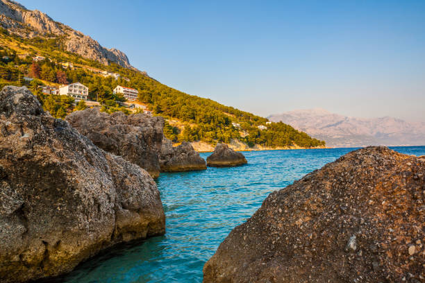 istock Rocky coastline with magical sunrise, Mimice, Croatia 883077196
