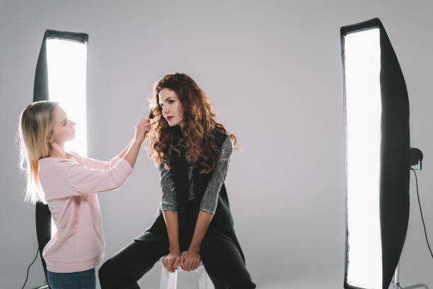 istock attractive model and hair stylist 883088318