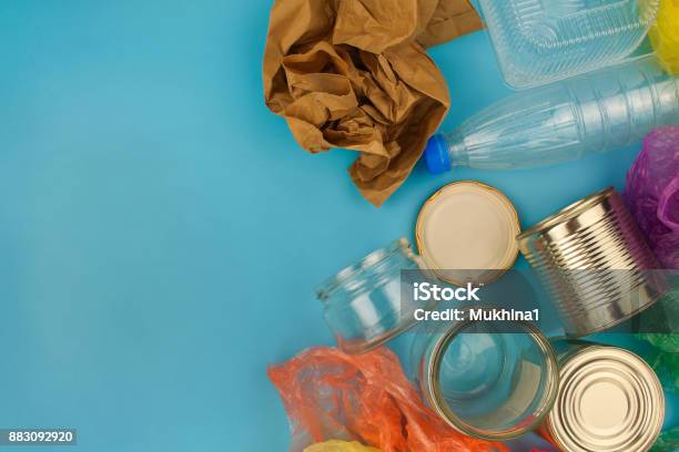Closeup Of Waste On Blue Background Top View Stock Photo - Download Image Now - Recycling, Waste Management, Glass - Material