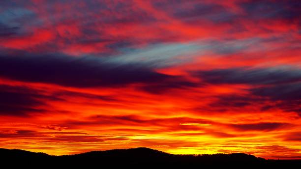 istock Intense red and orange sunset like burning sky in winter 883092946