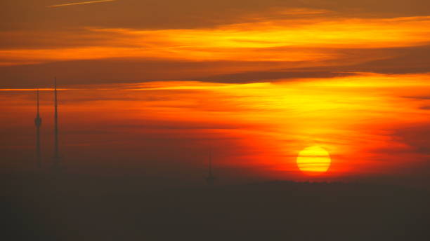 Orange sunset of fire next to the television tower in Stuttgart