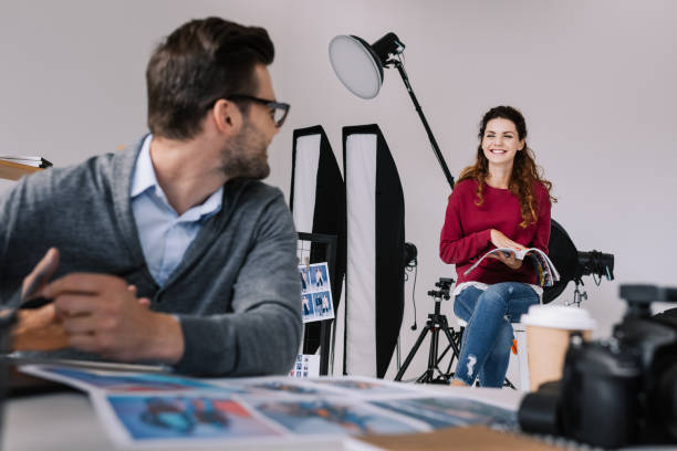 istock photographer and model in office 883095504
