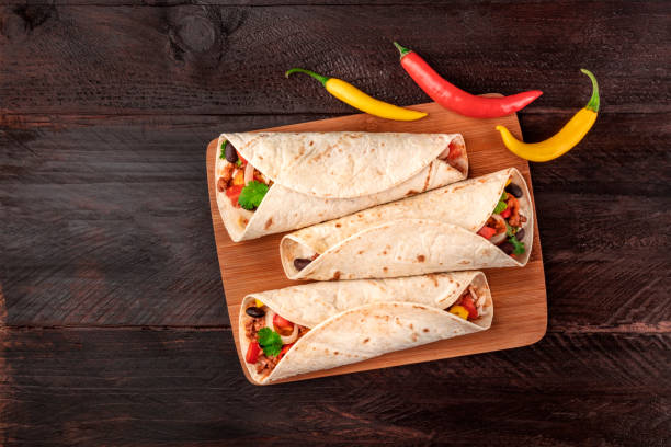 istock Mexican burritos with chili peppers, and copyspace 883099242
