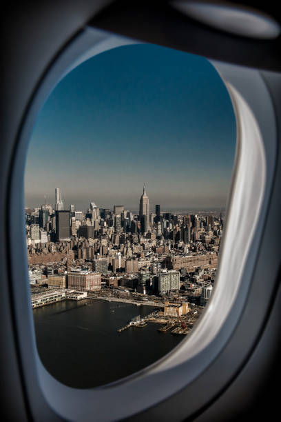 istock New York City skyline through airplane's window 883099504