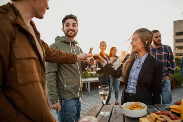 istock Celebratory Toast at the Rooftop Party 883100138