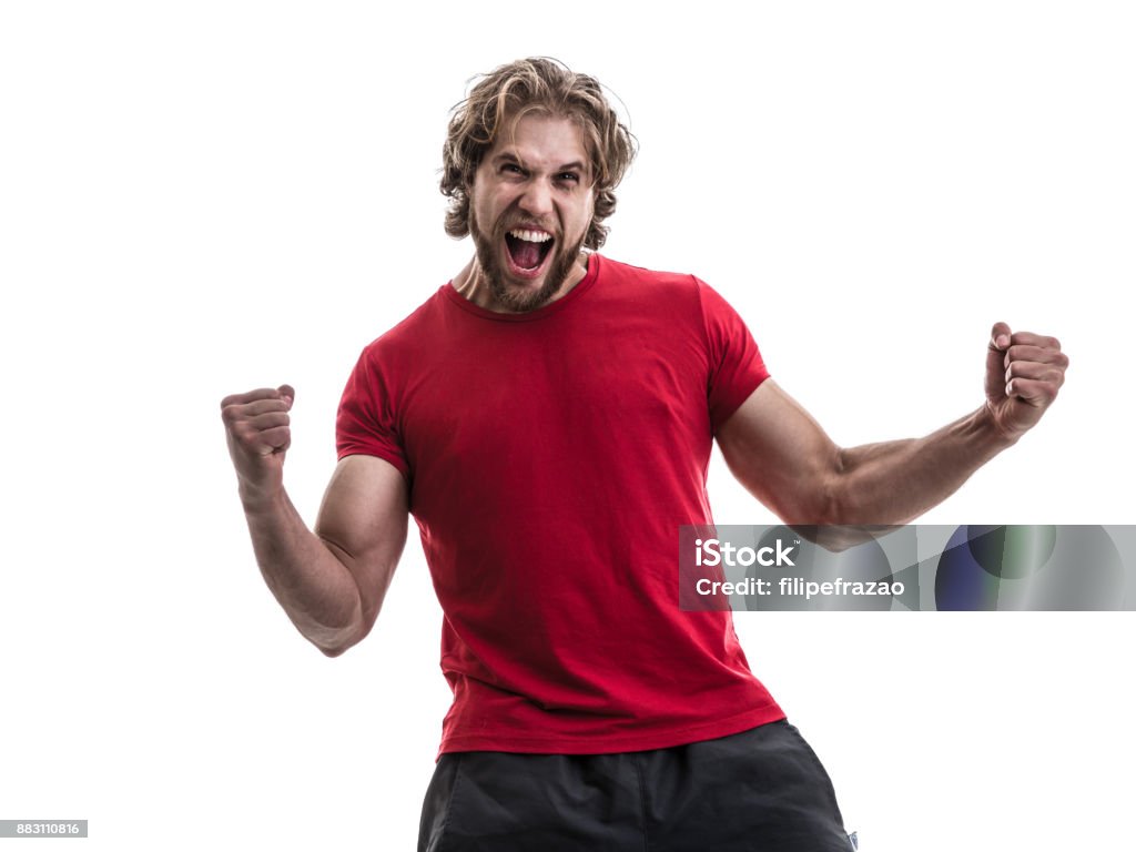 Male athlete / fan in red uniform celebrating on white background People collection Fan - Enthusiast Stock Photo