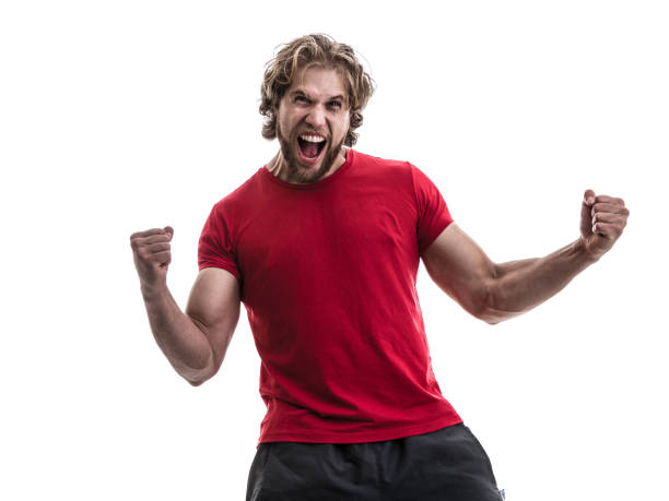 male athlete / fan in red uniform celebrating on white background - fan sport football male imagens e fotografias de stock