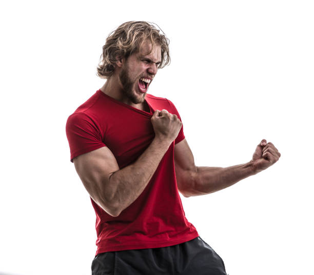 istock Male athlete / fan in red uniform celebrating on white background 883110826