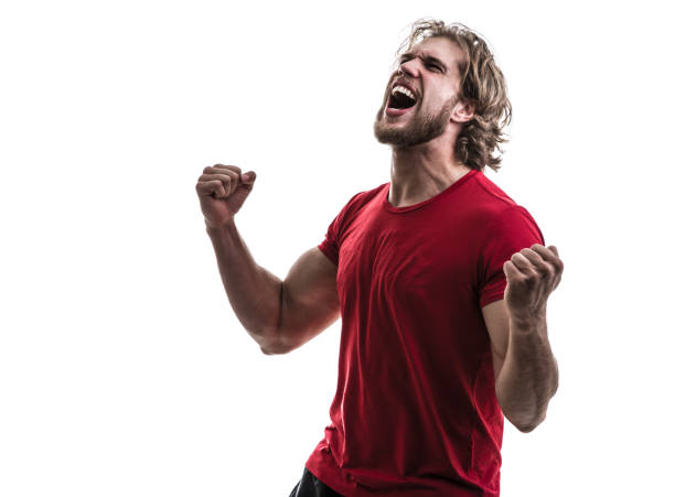 male athlete / fan in red uniform celebrating on white background - fan sport football male imagens e fotografias de stock