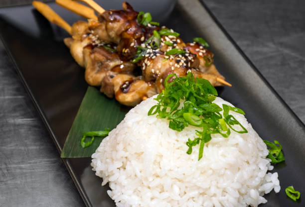 istock Teriyaki chicken skewers and rice 883111086