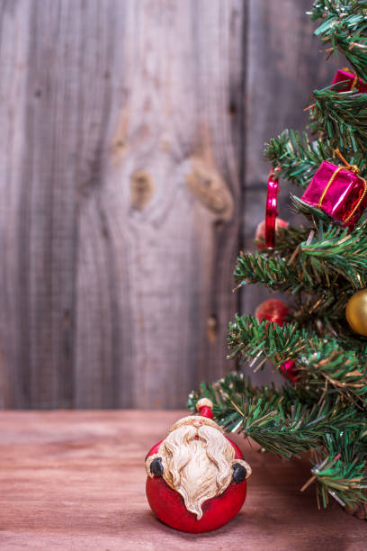 istock christmas tree on a wooden background 883113744