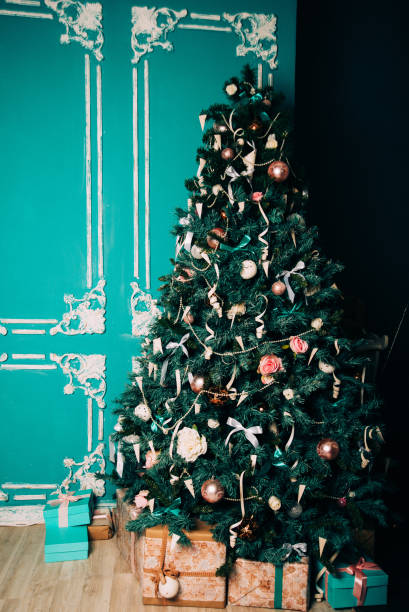 istock christmas tree with holiday white decorations and lights on silver background with copy space 883113808