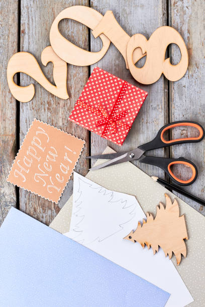 istock Handmade wooden number 2018, scissors, message. 883115118