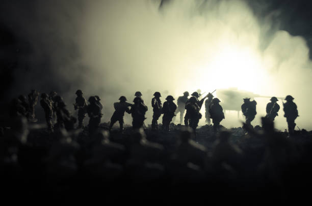 war concept. military silhouettes fighting scene on war fog sky background, world war soldiers silhouettes below cloudy skyline at night. attack scene. armored vehicles - military us military tank land vehicle imagens e fotografias de stock