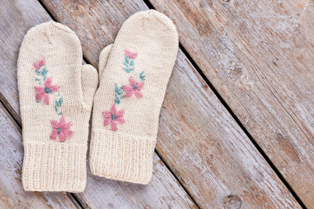 Close up of the two woman hand in the black gloves.