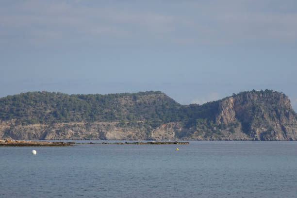 istock Cala Martina in Ibiza, Balearic Islands, Spain 883121576