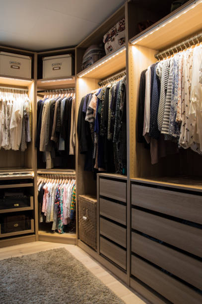 Walk in closet Luxurious walk in closet with lighting and jewelry display. walk in closet stock pictures, royalty-free photos & images