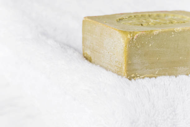 istock Organic olive soap on the white terry towel 883129342