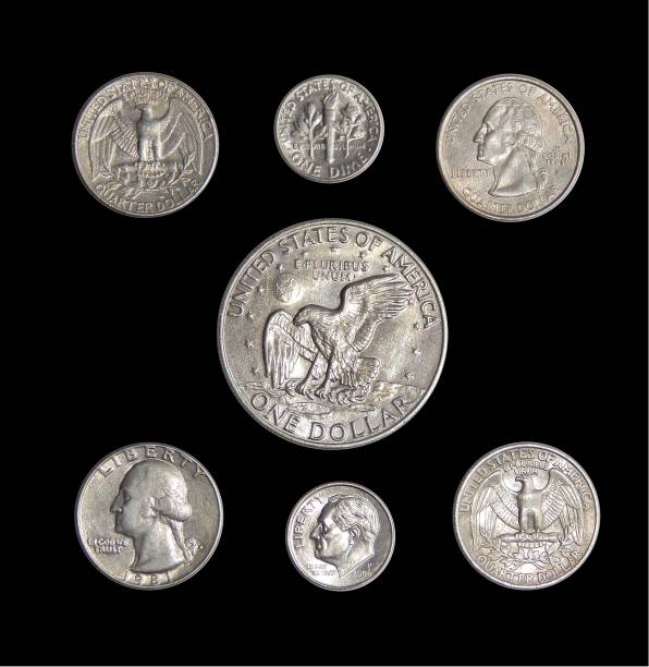 istock american coins on isolated black background 883136380