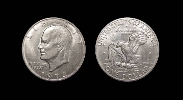 istock One US dollar coin on isolated black background 883136426