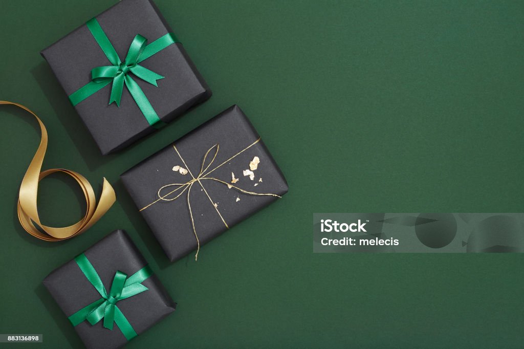 Christmas gif flat lay on green background Christmas Ornament, Christmas Decoration, Flat lay, Gift Box, green background Gift Stock Photo