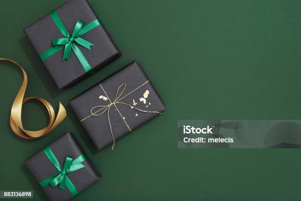 Christmas Gif Flat Lay On Green Background Stock Photo - Download Image Now - Gift, Backgrounds, Christmas Present