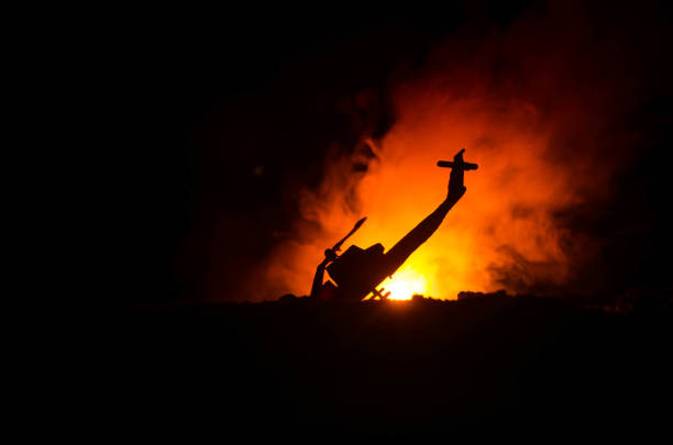 Air Crash. Burning falling helicopter. Destroyed helicopter. Decorated with toy at dark fire background. War or terrorism