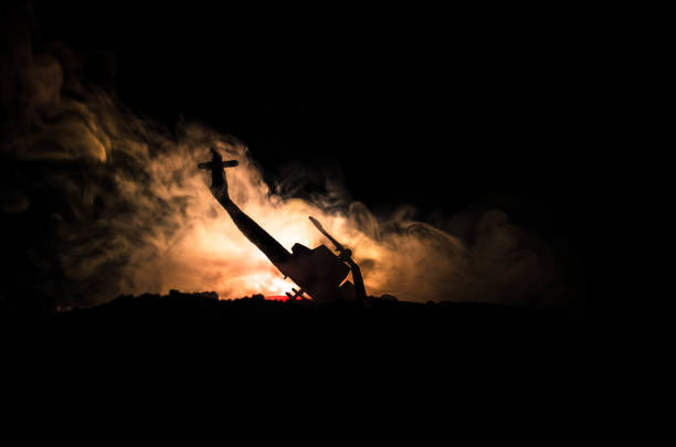 istock Air Crash. Burning falling helicopter. Destroyed helicopter. Decorated with toy at dark fire background. War or terrorism 883139146