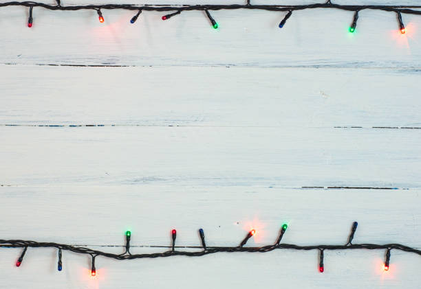 istock electric Christmas garland with colored small bulbs 883139530