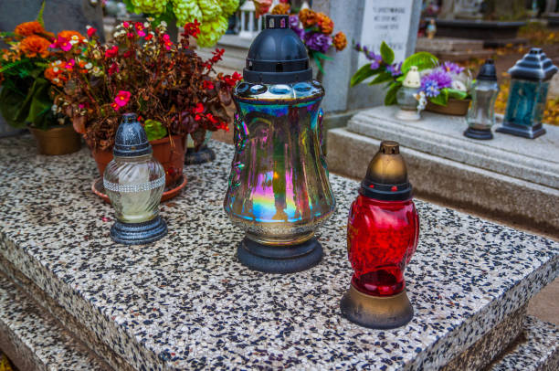 istock Colorful candles on the cemetery at All Saints Day 883140400