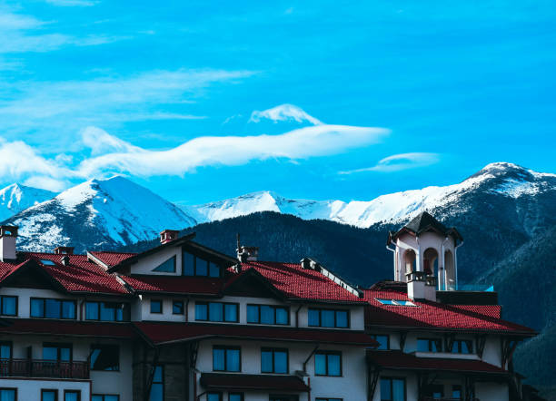 istock Mountain snow peak, Alpine village houses. 883140444