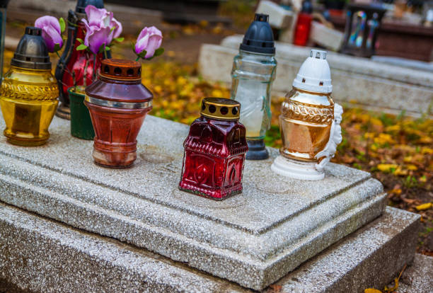 istock Colorful candles on the cemetery at All Saints Day 883140552