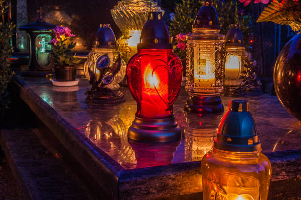 istock Colorful candles on the cemetery at All Saints Day 883144054
