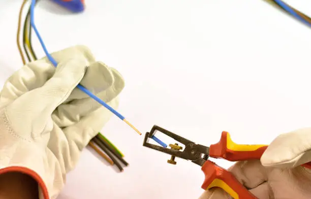 Photo of Electrician working with hand tools