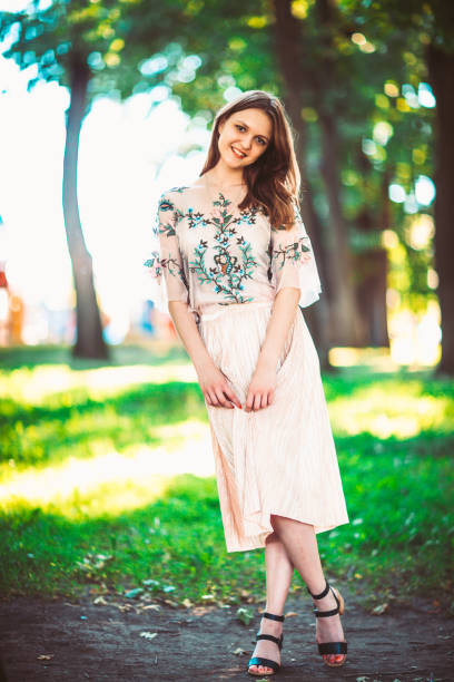 istock Beautiful young girl on a nature background 883153878