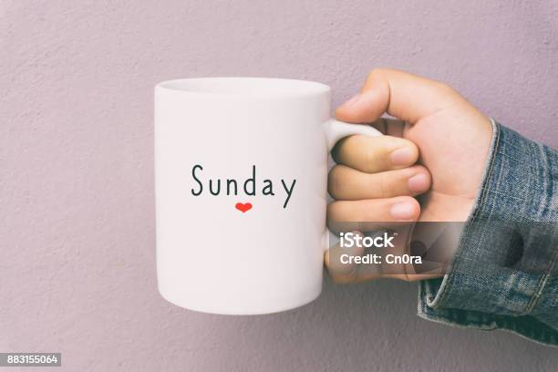 Sunday And Coffee Woman Holding A Cup Of Coffee Stock Photo - Download Image Now - Sunday, Relaxation, Mug